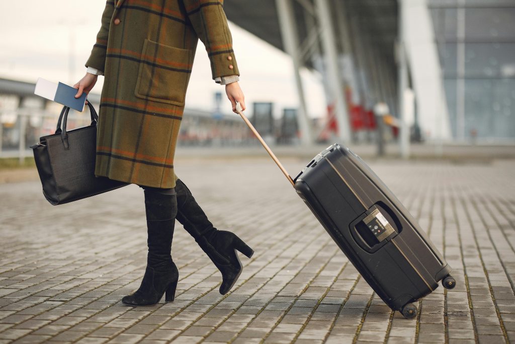Woman Travels Abroad with Luggage